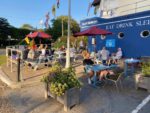 People sitting outside Pilot Boat Inn in the Summer by Wight Knuckle Brewery