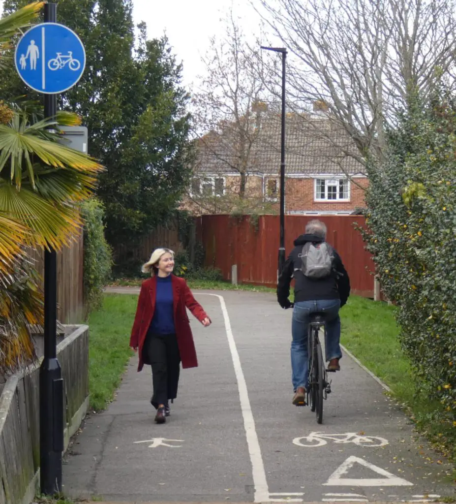 Walker and cyclist sharing path