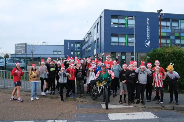 Students and staff at Carisbrooke College after the Santa Dash