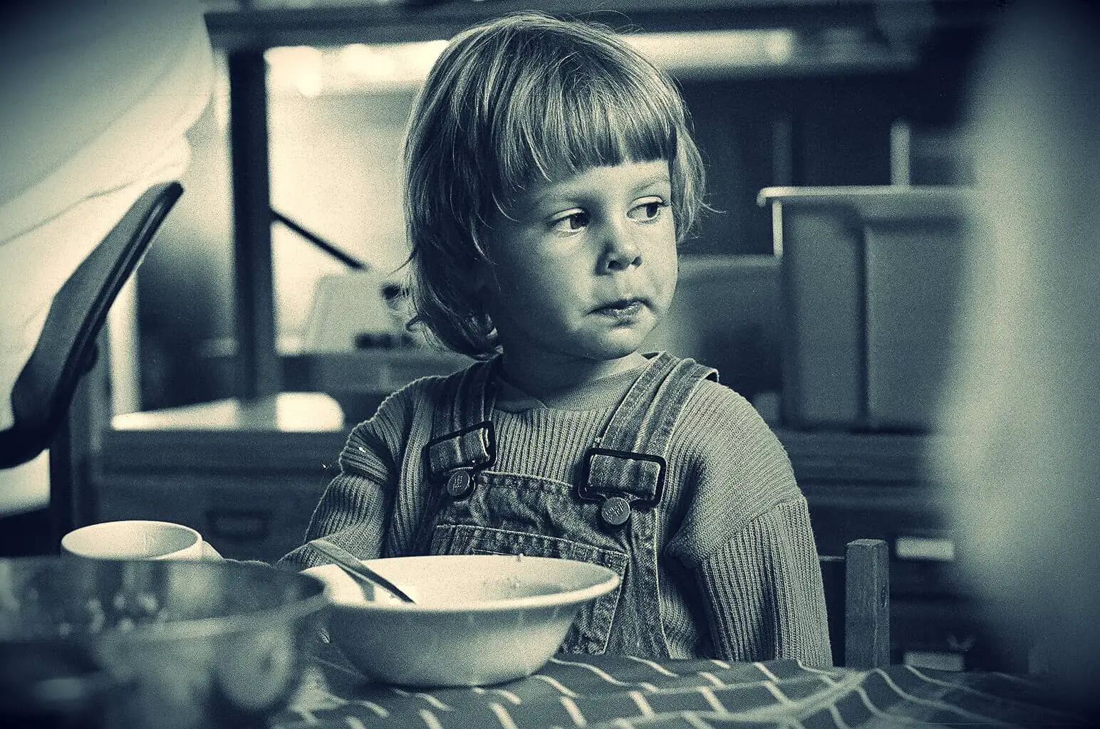Child eating breakfast - black and white photo