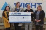 Giant cheque being held by WBM staff and Lorraine from Wessex Cancer Trust
