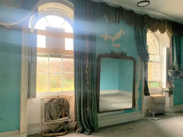 A room inside Norris Castle, with a former fire escape on the left of the picture.