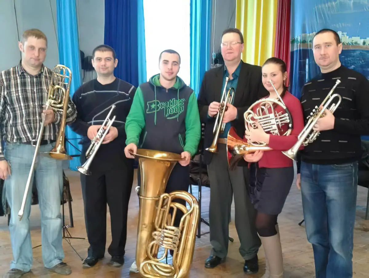 Andy Norman (fourth from left) with members of Odessa Premiere Brass in 2013