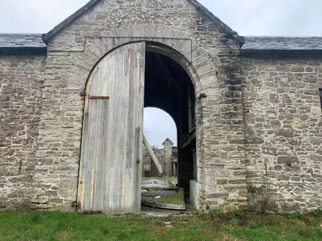 Doors in the farm building at Norris Castle which has come off its hinges