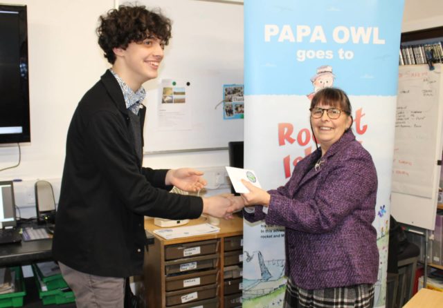 Nathaniel Lowthion-Craggs receiving his award from Helen Blake, Wight Aviation Museum Chairperson