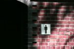 Sign on brick wall for Male toilets by taichi nakamura