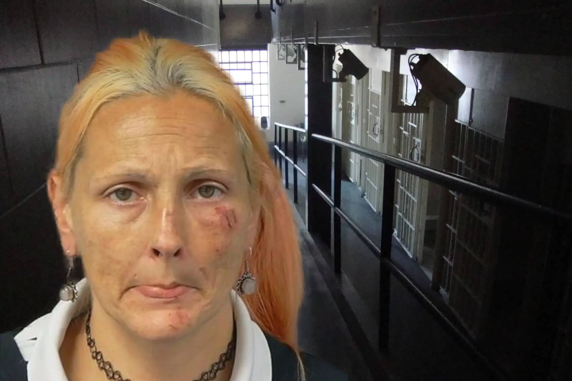 Emma Stafford mug shot with jail corridor in background