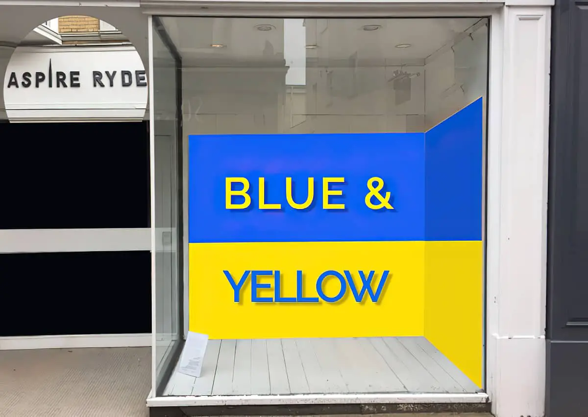 Empty Ryde Aspire gallery window with Blue and Yellow Sign inside