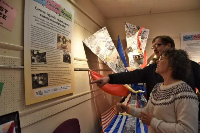 Residents taking in the exhibition panels in new exhibition