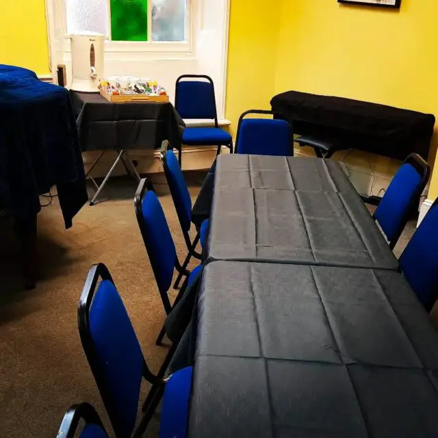 The Yellow Room with tables and chairs