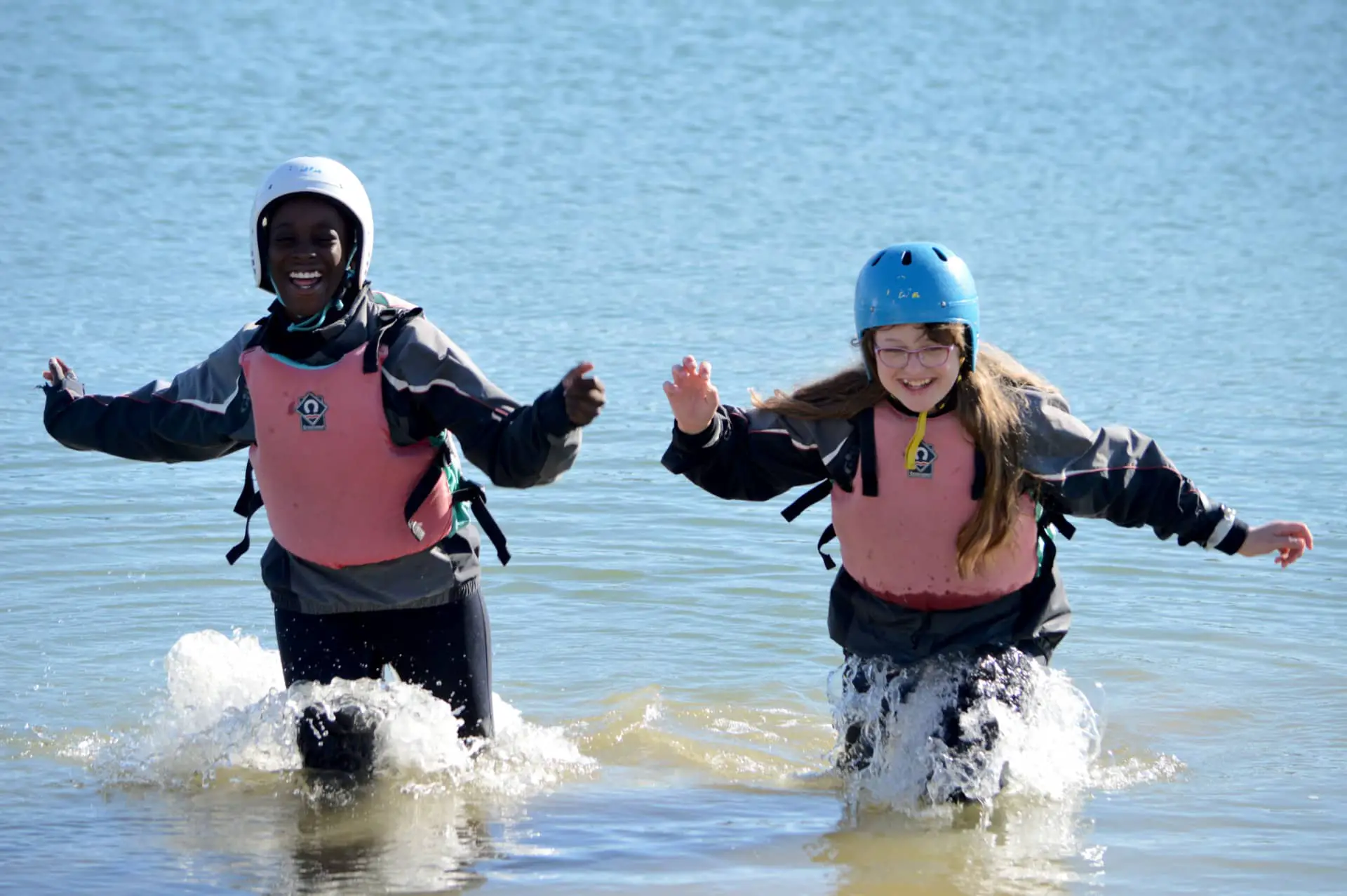 Two students at UKSA coming out of the water