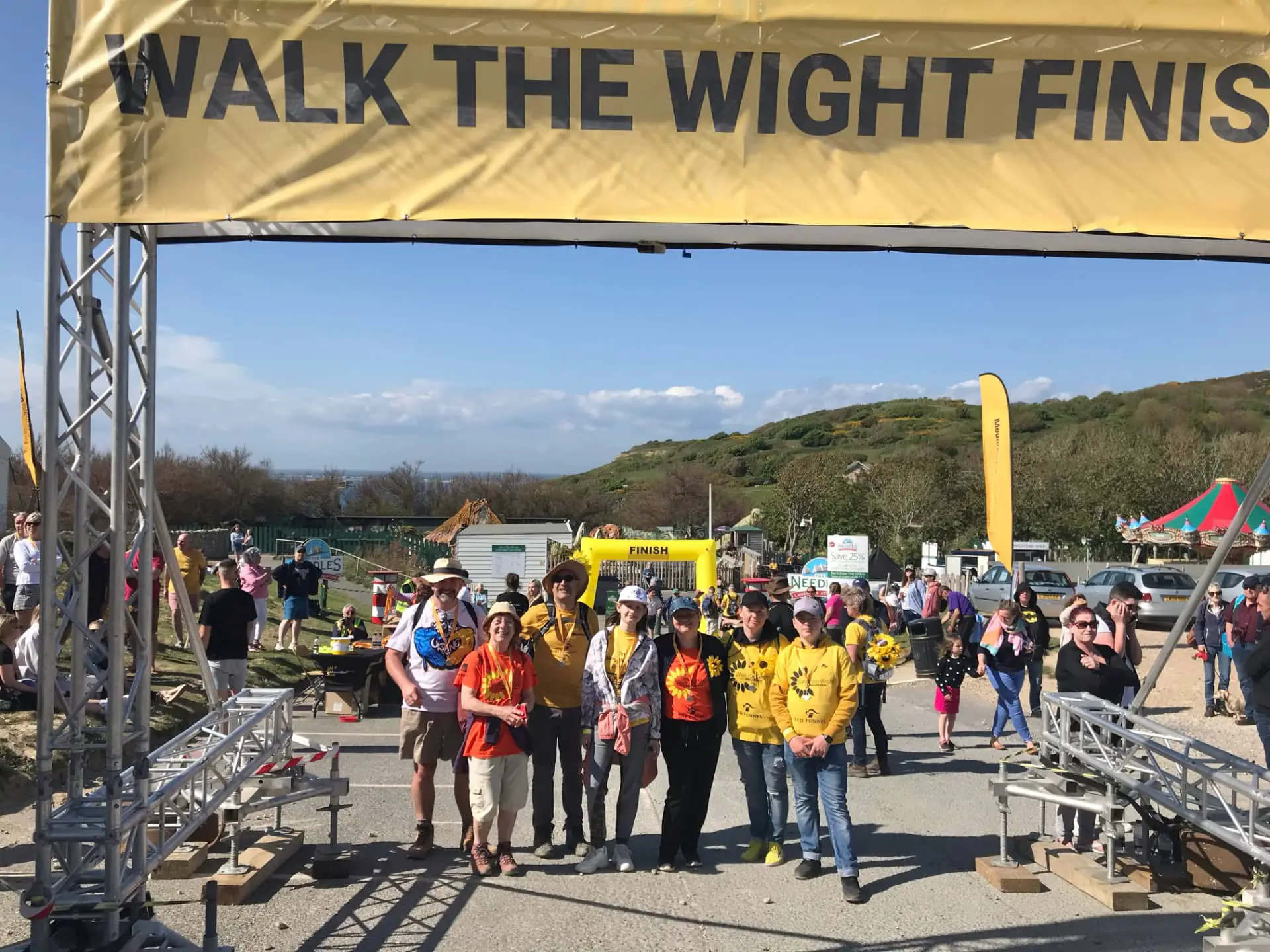 Chris and Barbara Jarman on Walk the Wight with displaced Ukrainians at finish line