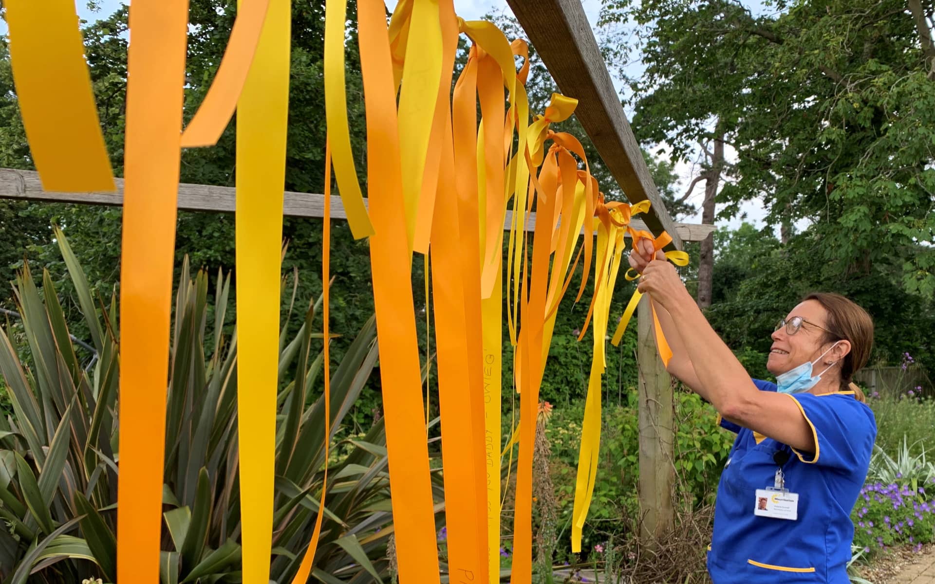 Vicky adding ribbons to the garden display