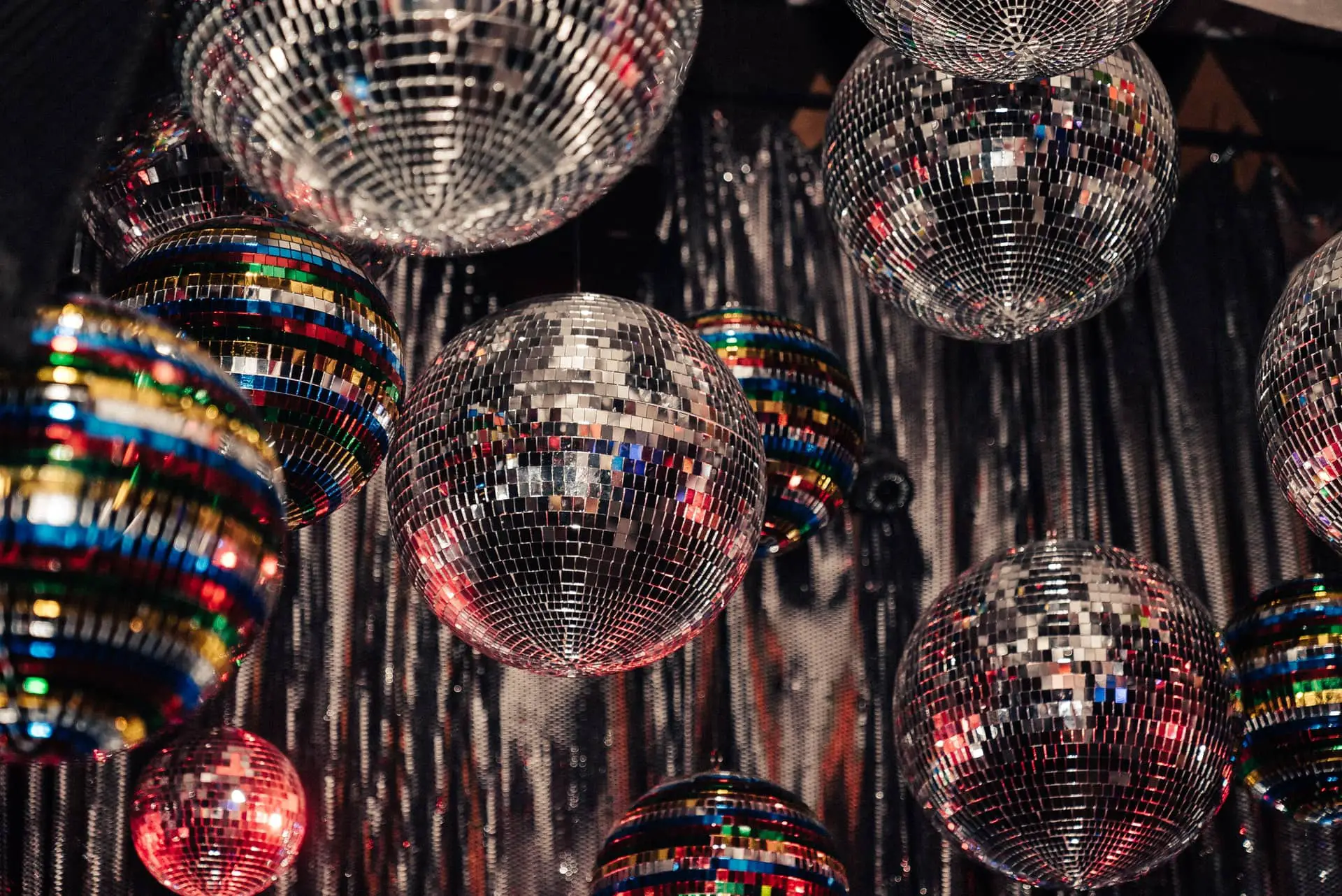 Lots of glitter balls hanging from the ceiling
