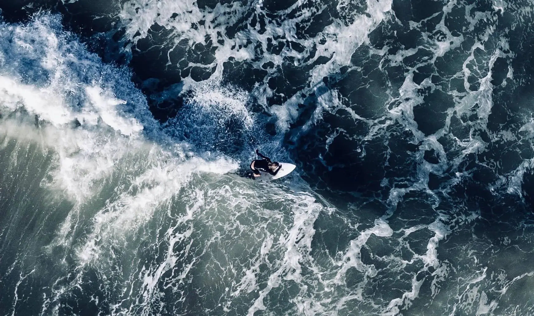 Aerial view of female surfer by Sam Scadgell