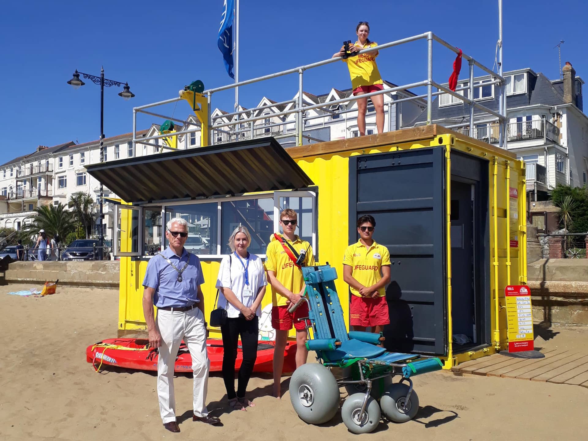 Councillor Paddy Lightfoot, mayor of Sandown, and Danielle Wharton, contract and commissioning officer at the Isle of Wight Council, with Sandown Beach Lifeguards