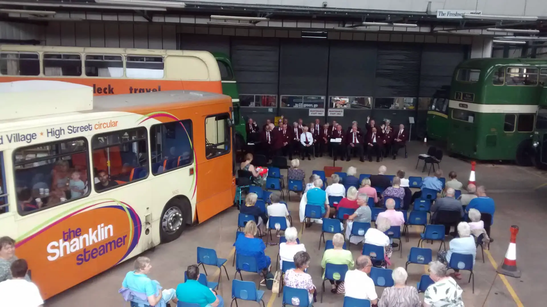 Choir singing at the Bus Museum