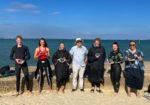 Ryde beach lifeguards and Cllr Lilley standing on the beach after swimming the Solent