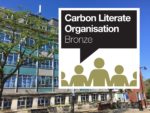 Photo of county hall with carbon literate organisation badge laid on top