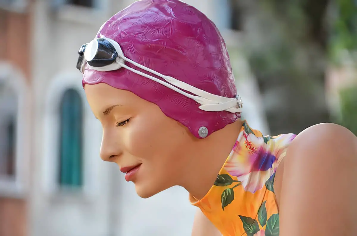 female model wearing a swimming cap