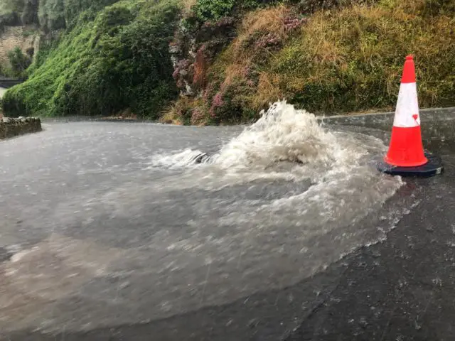 Manhole cover lifted by the surge