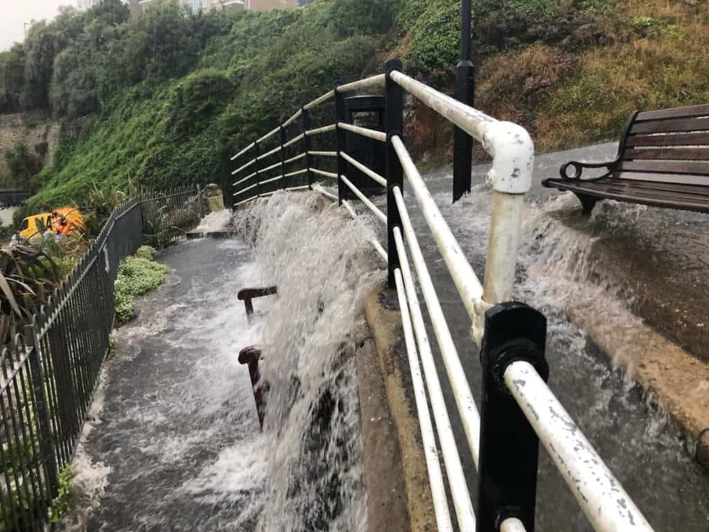 Rain water flowing over bench