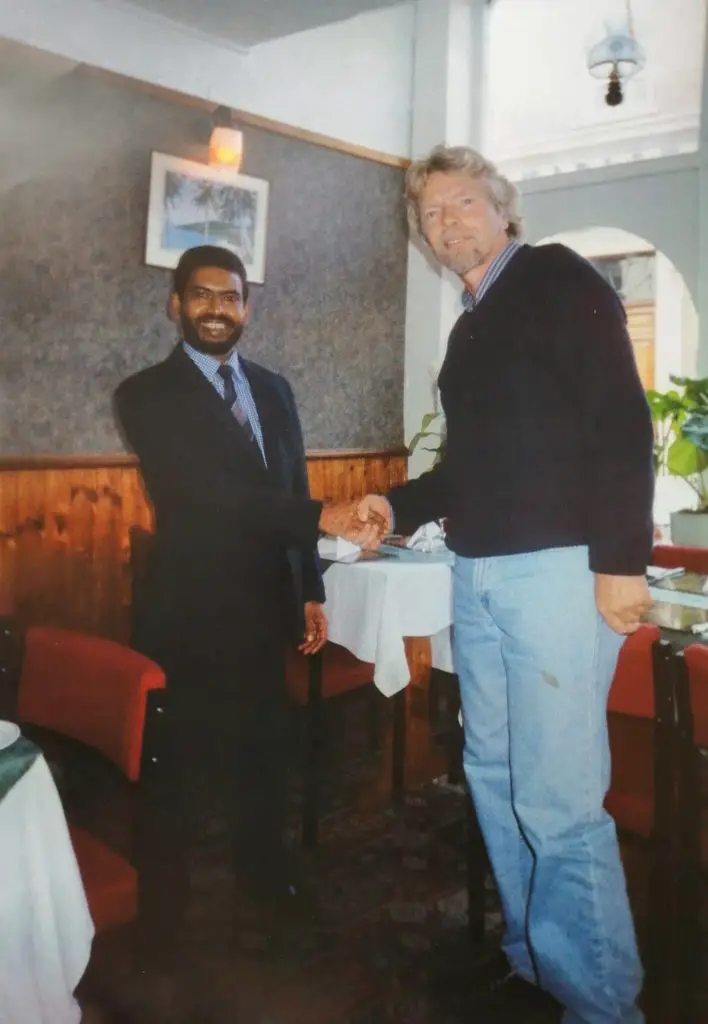 Richard Branson visits Bahar Tandoori in 1997, shaking hands with Abdul