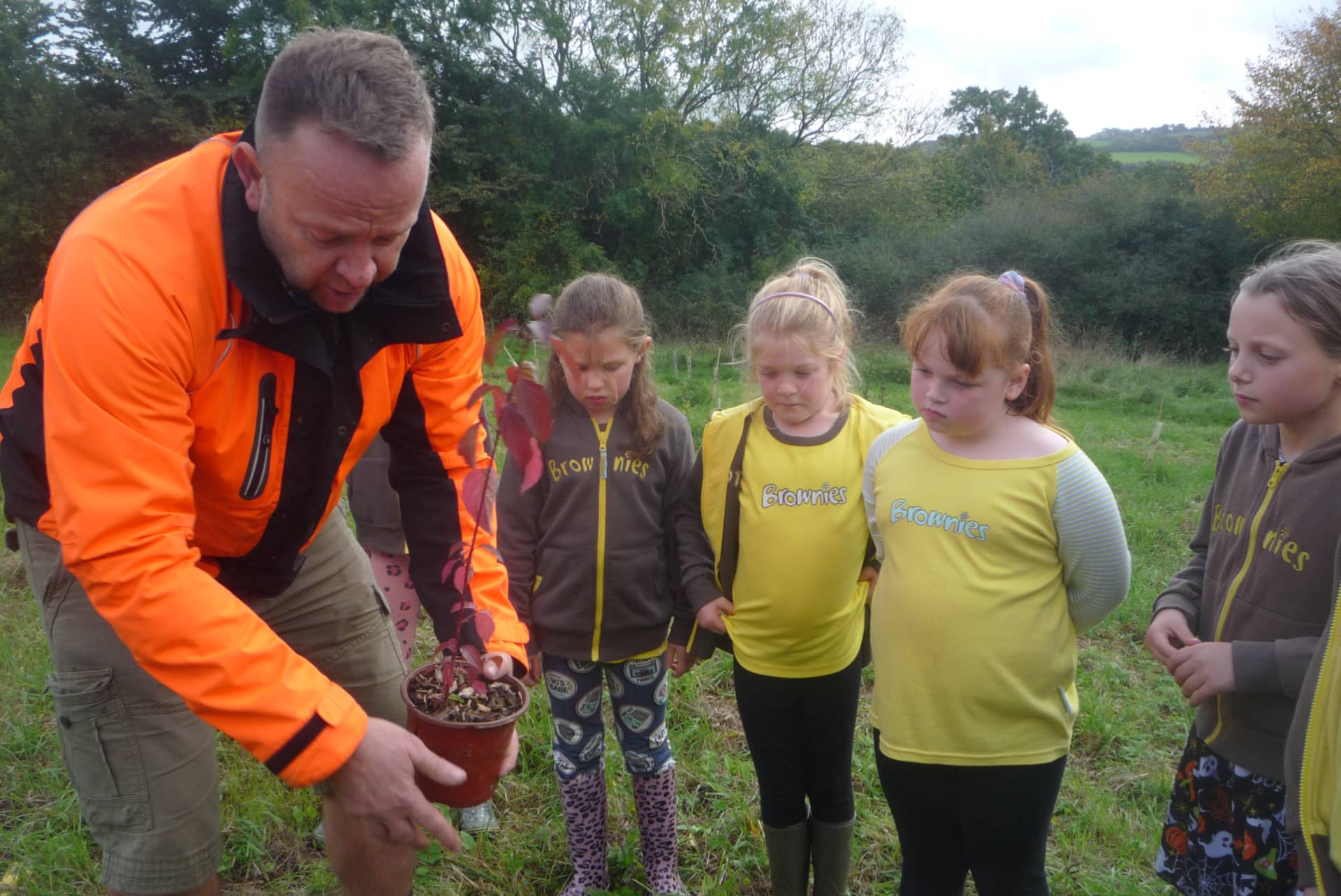 Karl with the Brownies planting tree
