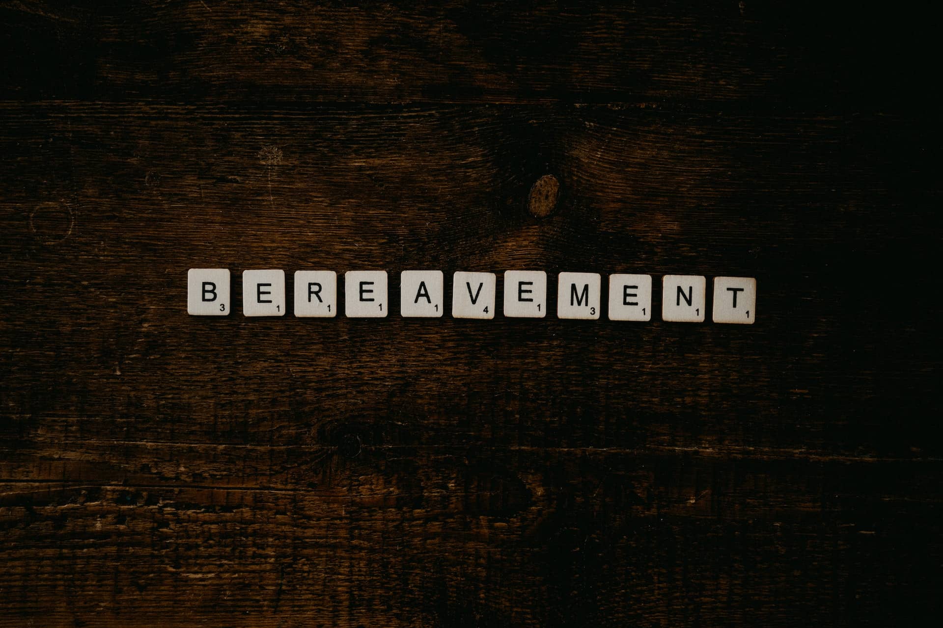 Letters on a table spelling out bereavement