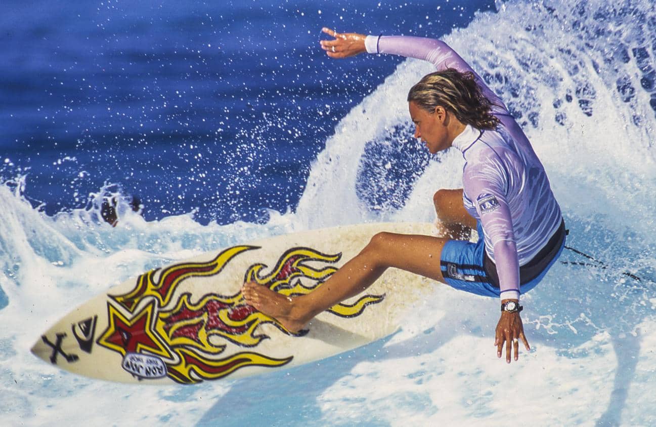 woman riding a wave from the Girls can't surf film - Madman Filmswoman riding a wave from the Girls can't surf film