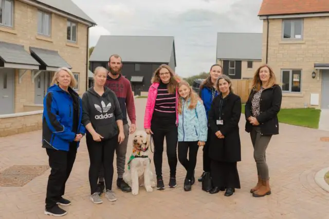 New community: L to R - Carol Coleman (Vectis Housing Officer), Teressa and Chris Gough (tenants), Tracey Wagstaff and Dottie-Rose with Honey (tenants), Rosie McGlinchey (Vectis Trainee Housing Officer), Sharon Harvey (Vectis Operations Director), Jo Sandells (Vectis Housing Services Manager)
