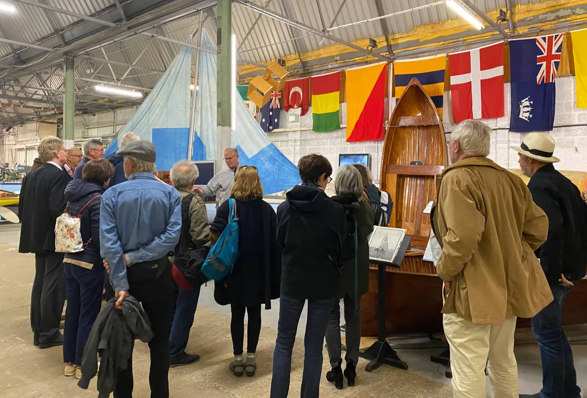 People on a tour of the classic boat museum