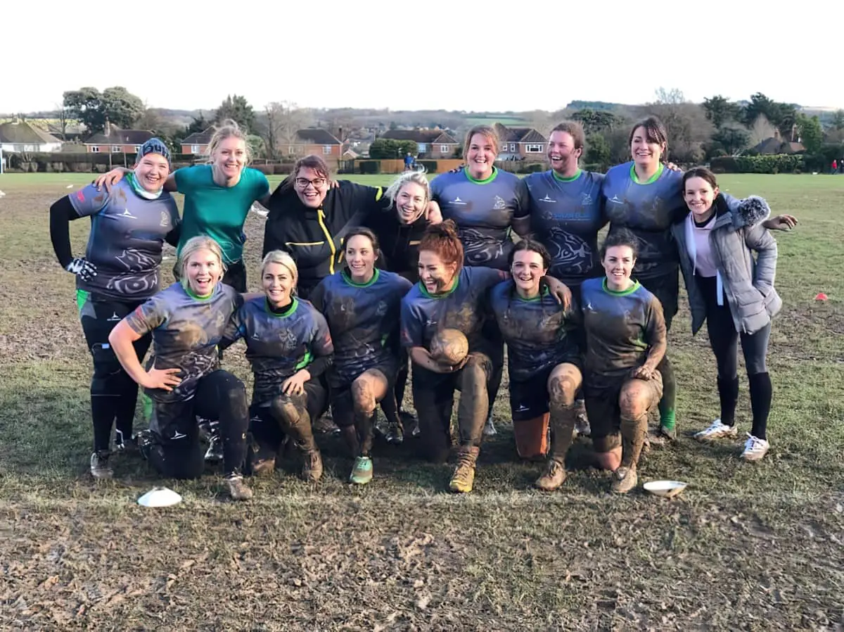 Wight Wolves rugby team - after a match covered in mud