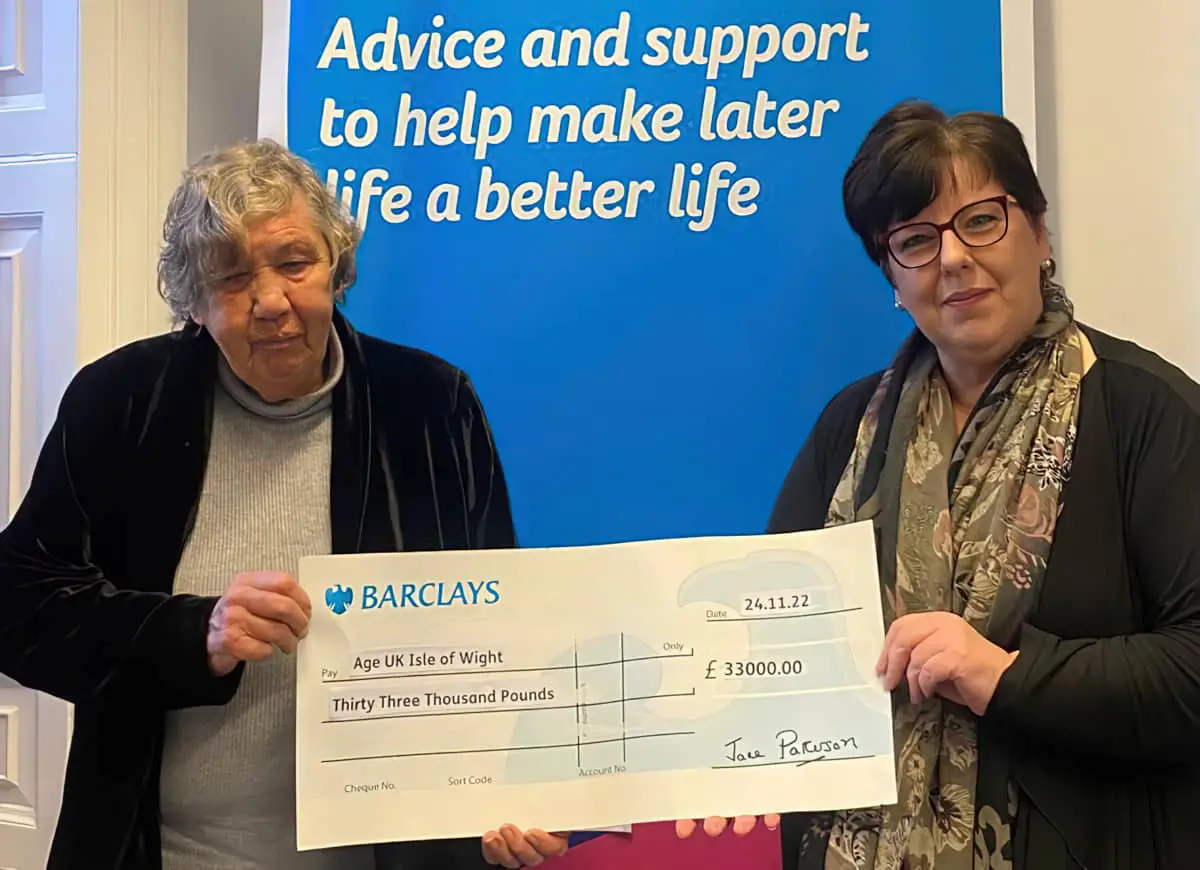 £33,000 Age UK cheque being presented
