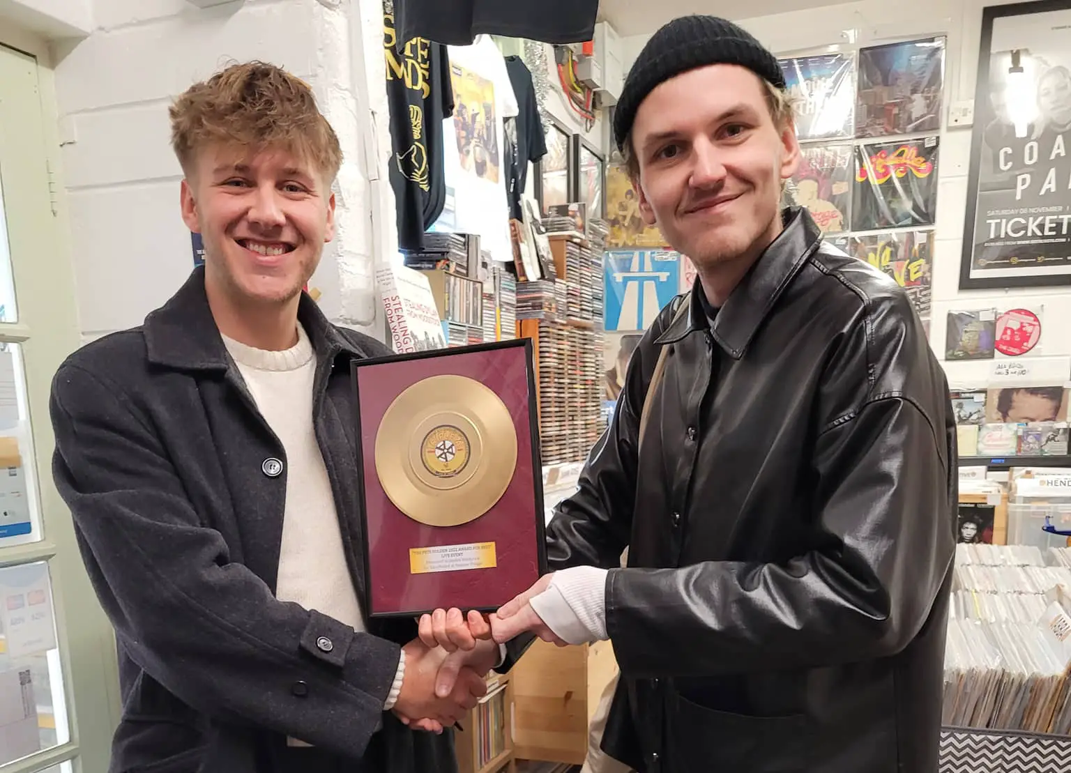Jayden Hitchcock (left) being presented with AAA Records award by Joe Perry from Coach Party