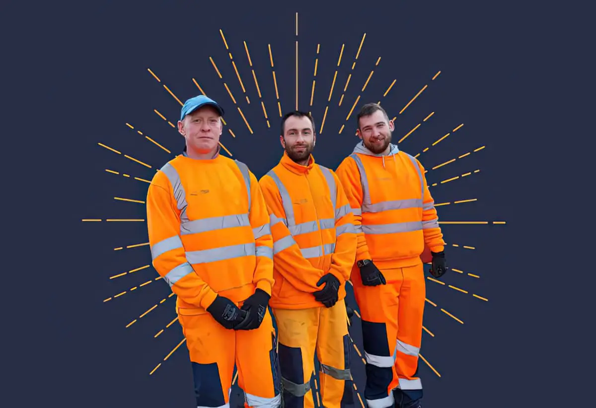 Three waste collection crew members