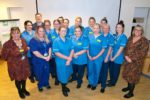 Registered Apprentice Nurses with Donna Parkinson, Head of Learning, Education and Development, Juliet Pearce, Director of Nursing, Midwifery and AHPs, Darren Cattel, CEO Isle of Wight NHS Trust with OTW flas