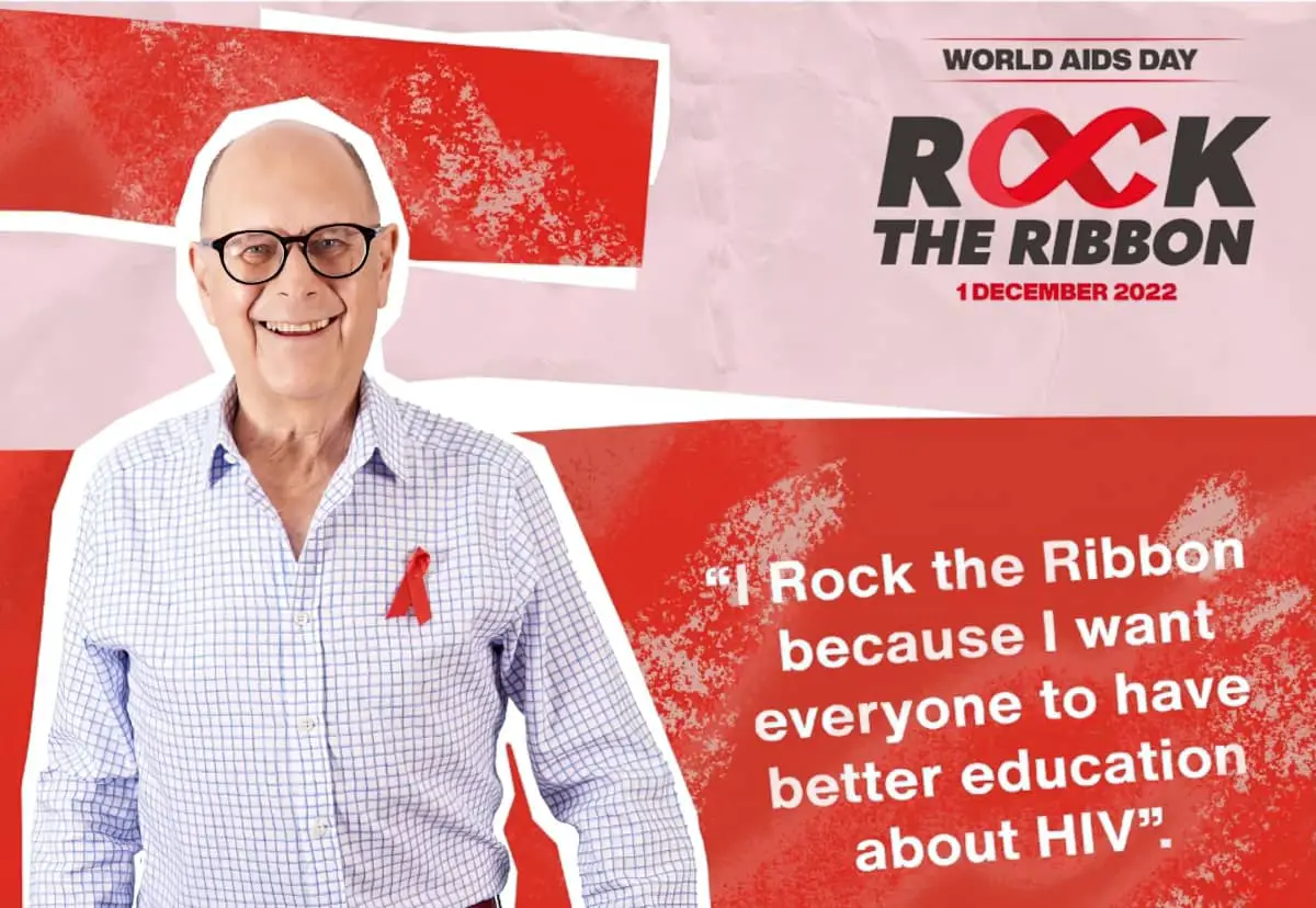 Man wearing Aids Day ribbon with message about World Aids Day