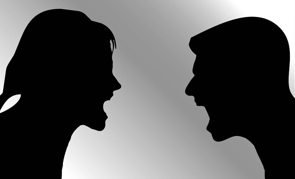 Silhouette of people arguing