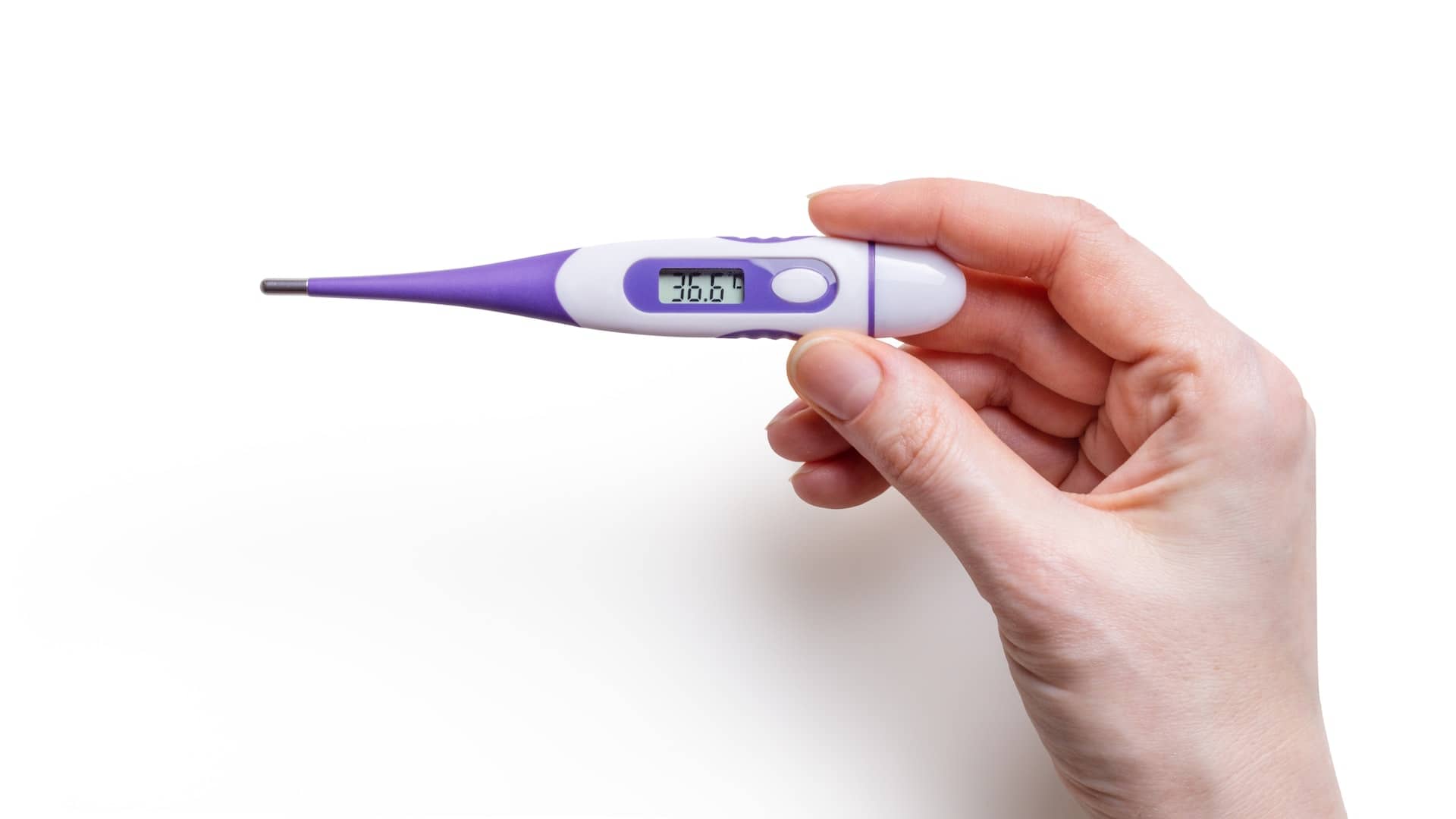 hand holding a thermometer