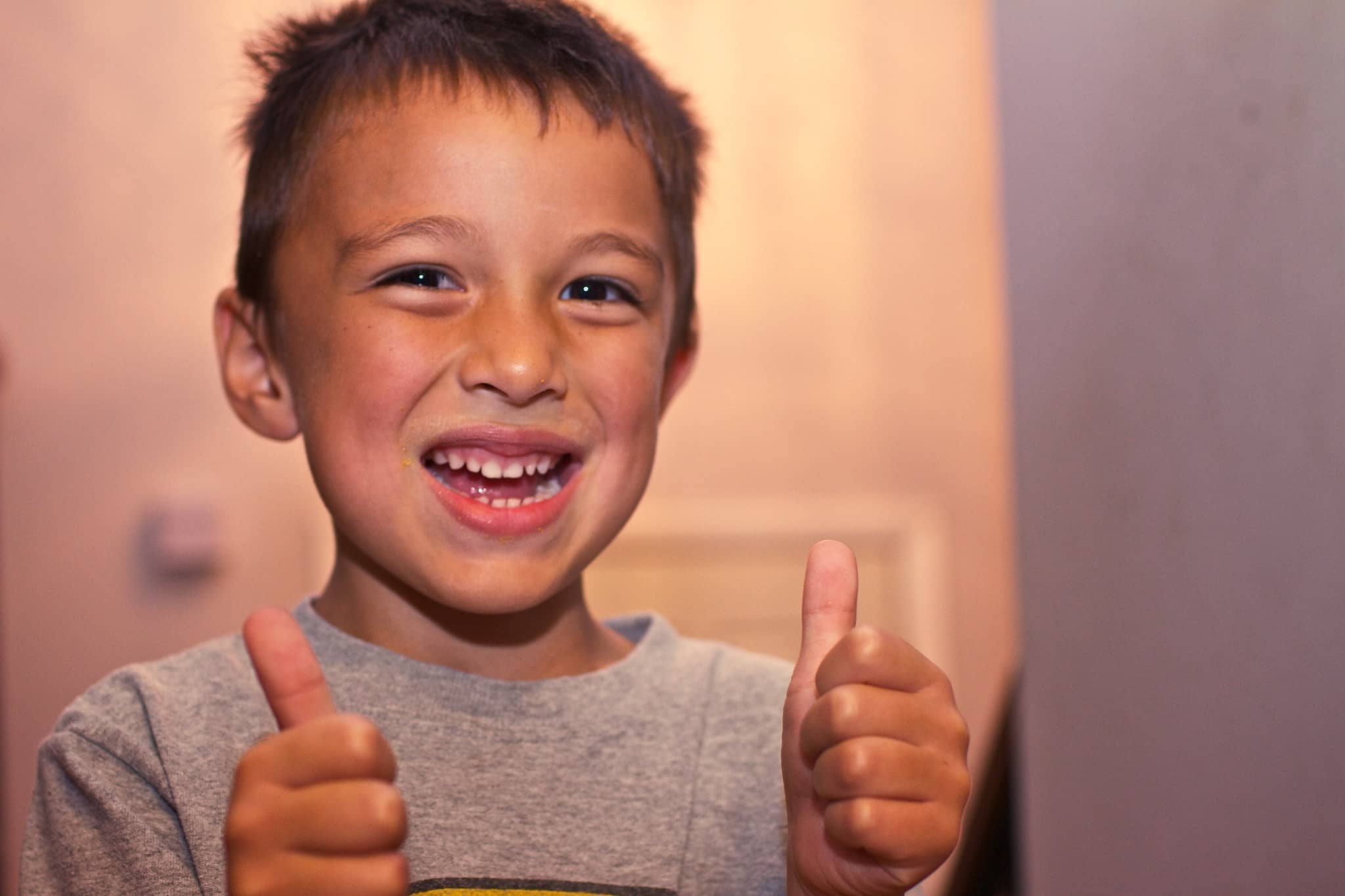 Child giving thumbs up