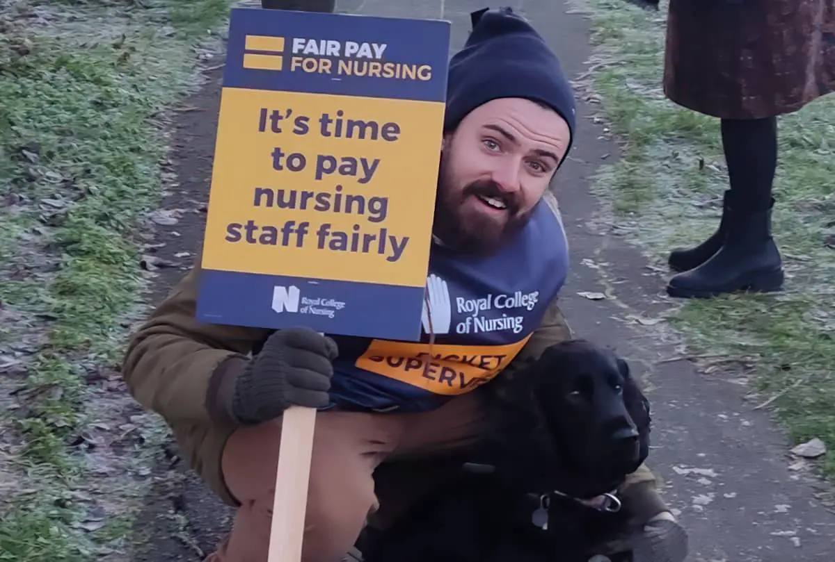 Harry Eccles on the picket line with a dog