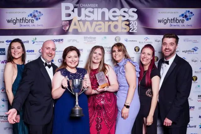 The team at Top Mops celebrate being named Business Of The Year at the IW Chamber Business Awards in May 2022