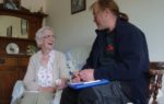 Ray from The Footprint Trust with an older Resident