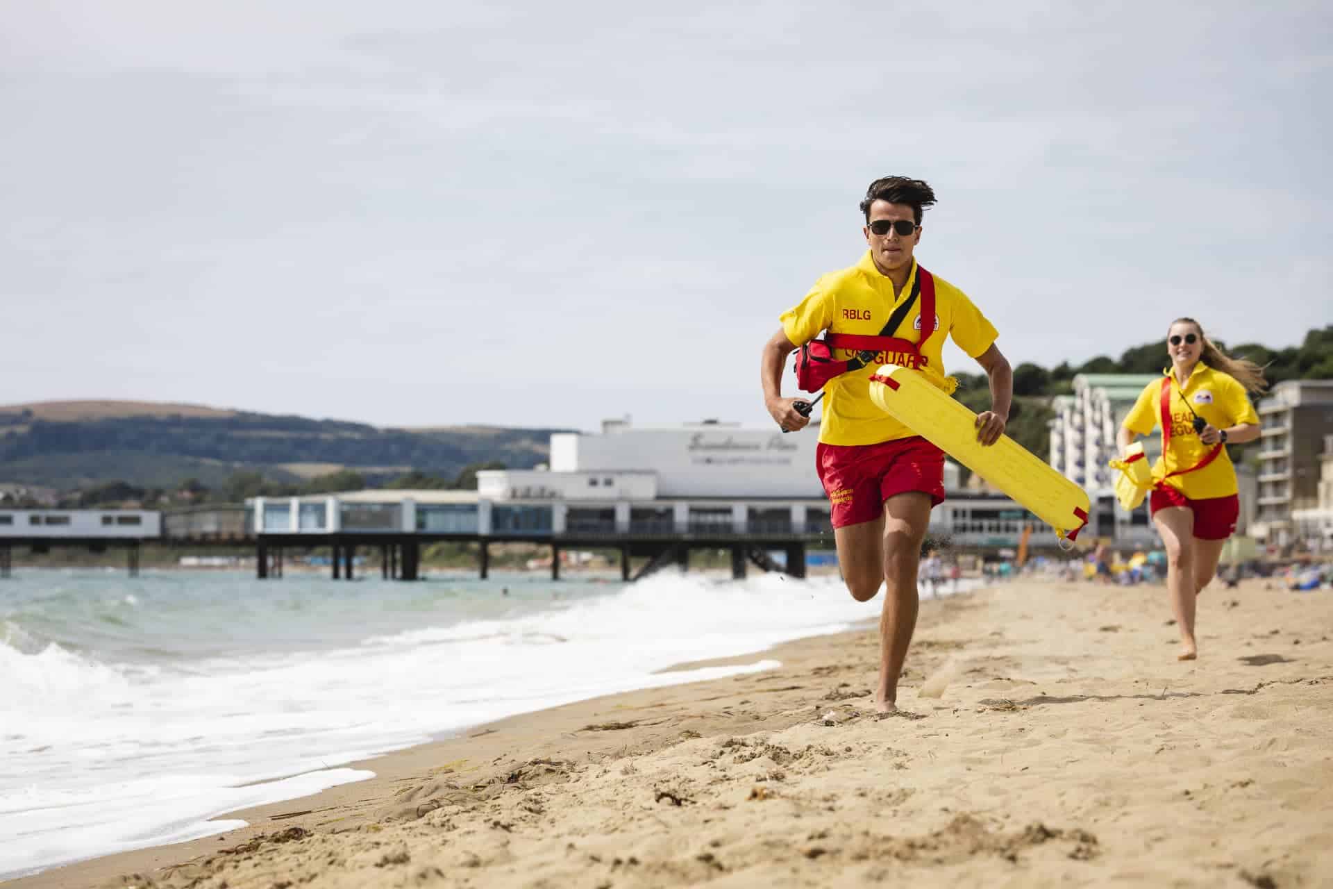 Sandown Lifeguards running along the beach