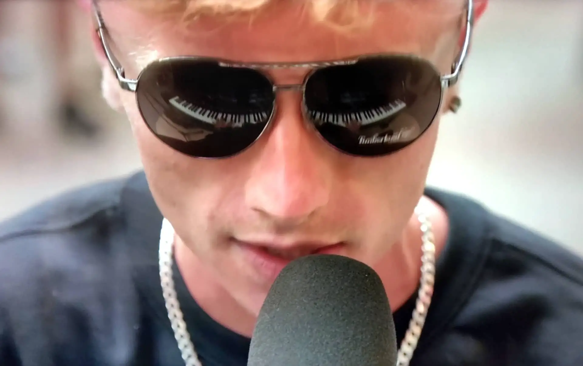 Jay Eatwell with piano reflection in sunglasses