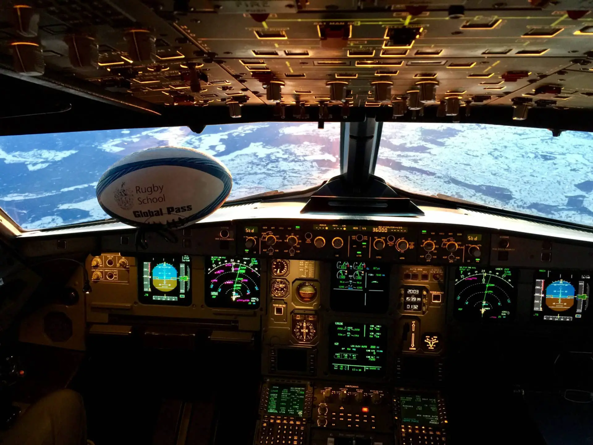 Rugby ball in flight deck of airplane