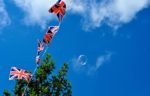 Union flag bunting against a blue sky