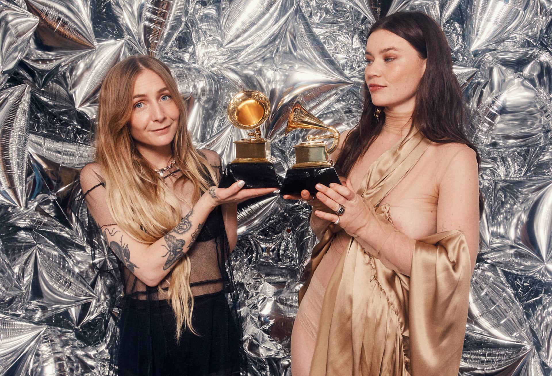 Wet Leg's Hester and Rhian holding their two Grammy Awards