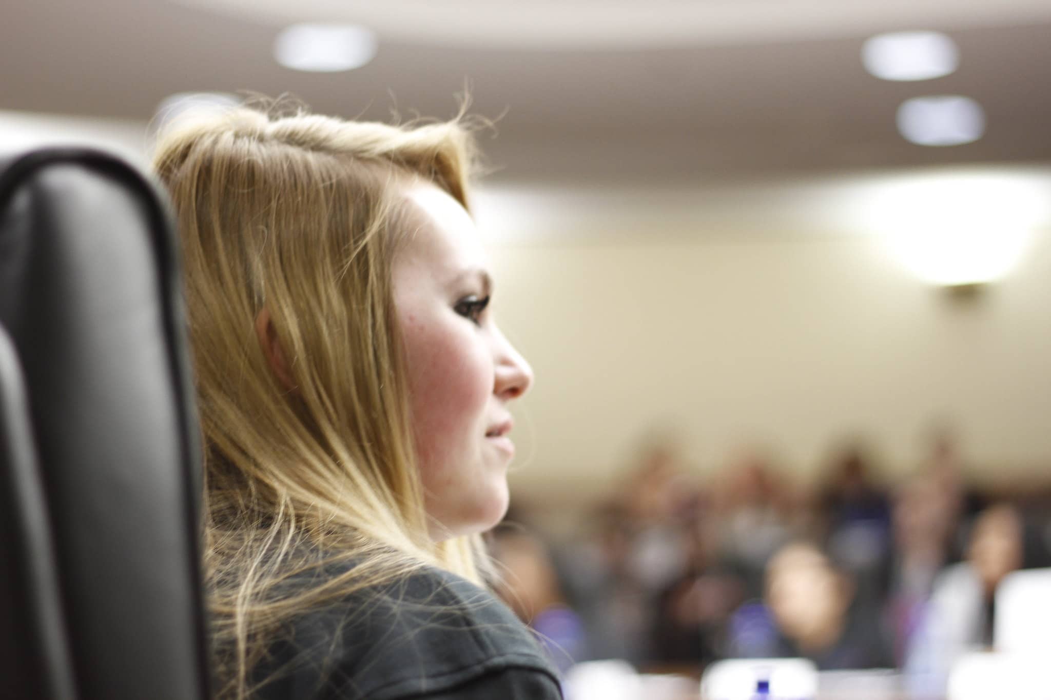 Young woman at youth council meeting